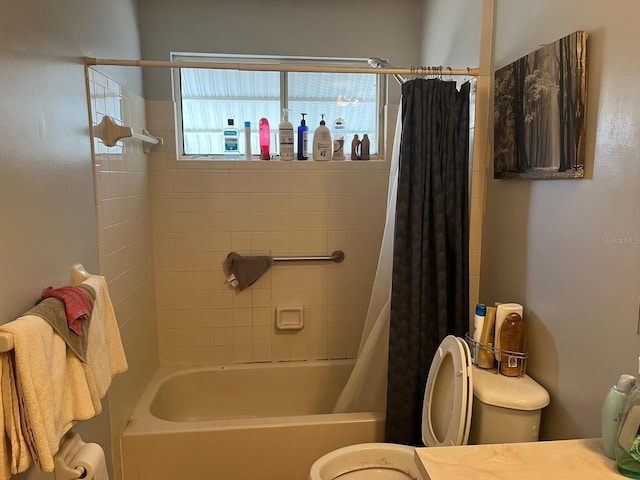 full bathroom with shower / bath combo, vanity, and toilet