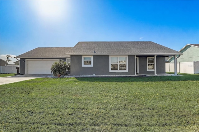 ranch-style house featuring a front lawn and a garage