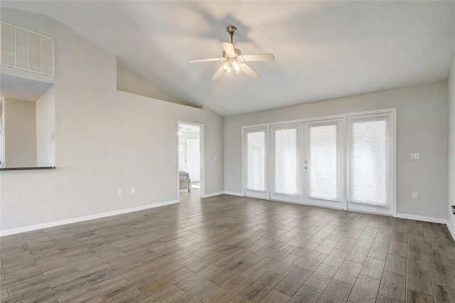 spare room featuring vaulted ceiling and ceiling fan