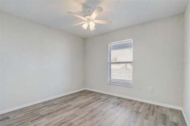 unfurnished room featuring ceiling fan and light wood-type flooring