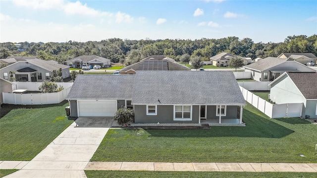 view of front of home featuring a garage and a front lawn