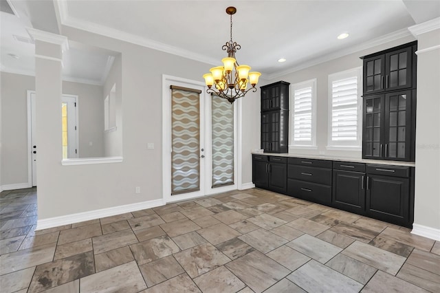 unfurnished dining area with an inviting chandelier and crown molding