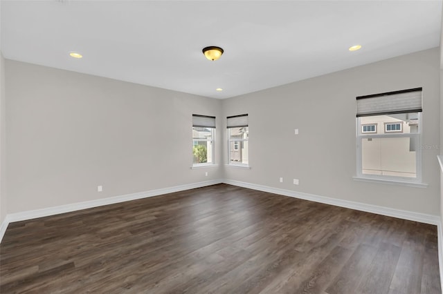 unfurnished room featuring dark hardwood / wood-style flooring