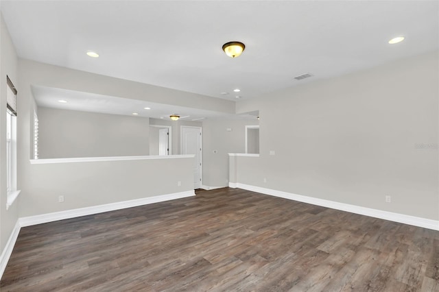 empty room featuring dark wood-type flooring