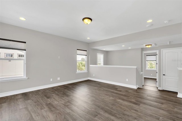 empty room with dark wood-type flooring