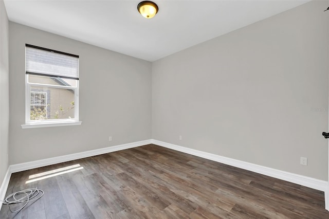 empty room with dark hardwood / wood-style floors