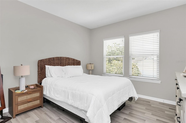 bedroom with light hardwood / wood-style flooring