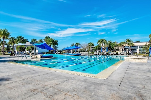 view of swimming pool with a patio area