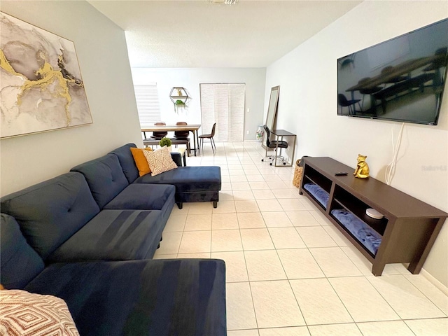 living room with light tile patterned flooring