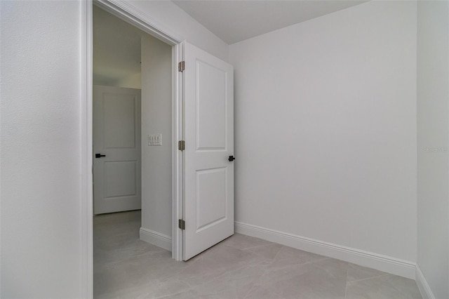 hallway featuring light tile patterned floors