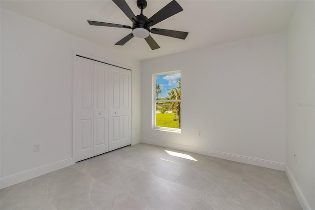 unfurnished bedroom with a closet and ceiling fan