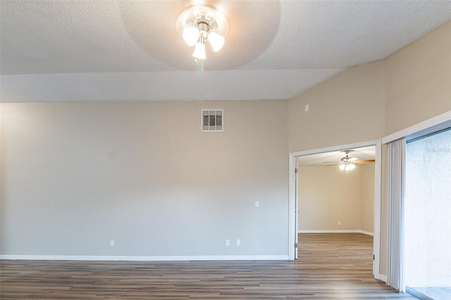 unfurnished room with wood-type flooring, a textured ceiling, and ceiling fan