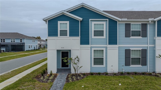 view of front of home featuring a front yard