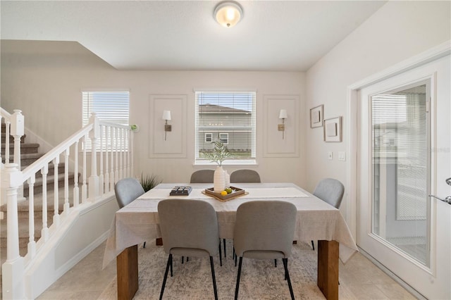 dining area featuring light tile patterned flooring