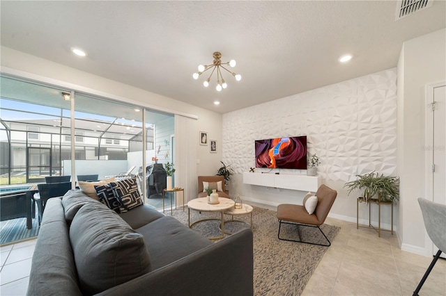 tiled living room featuring a chandelier