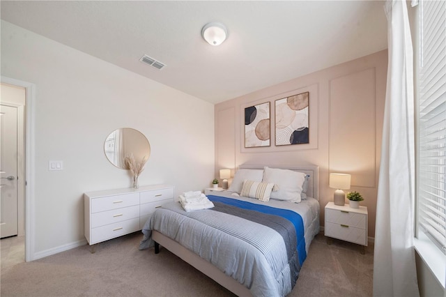 bedroom featuring carpet floors and multiple windows