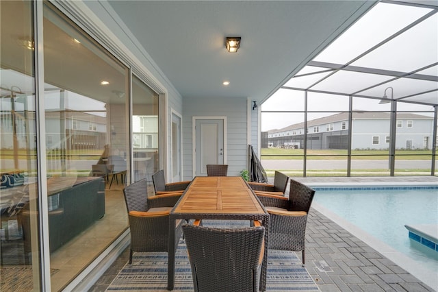 sunroom / solarium with a swimming pool