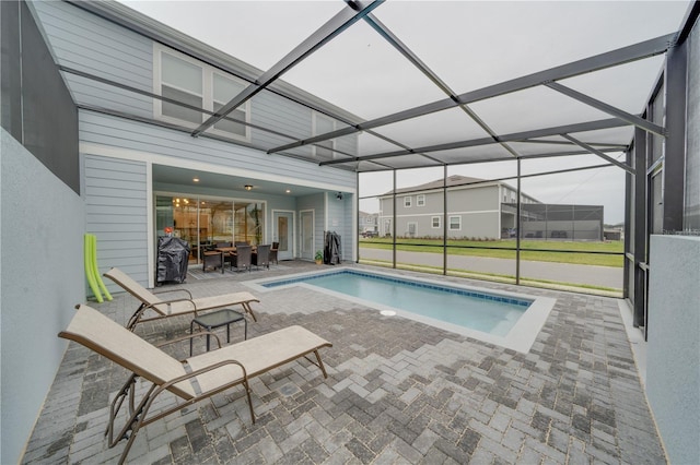 view of pool featuring a lanai and a patio area