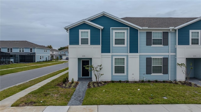 view of front facade with a front lawn