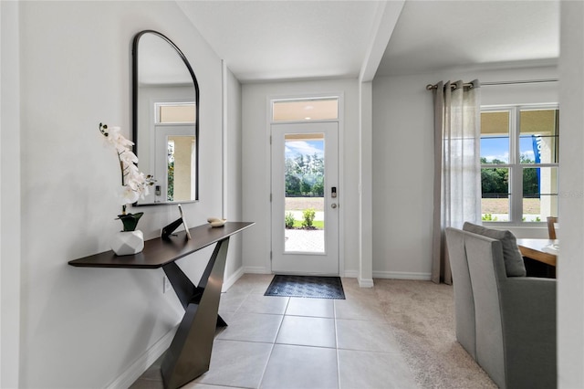 foyer featuring light tile patterned flooring