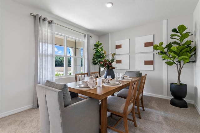 view of carpeted dining space