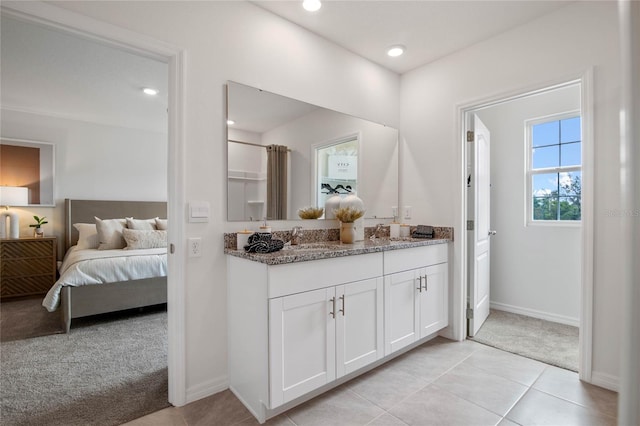 bathroom with tile patterned flooring and vanity