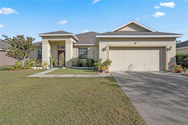 view of front facade with a garage and a front lawn