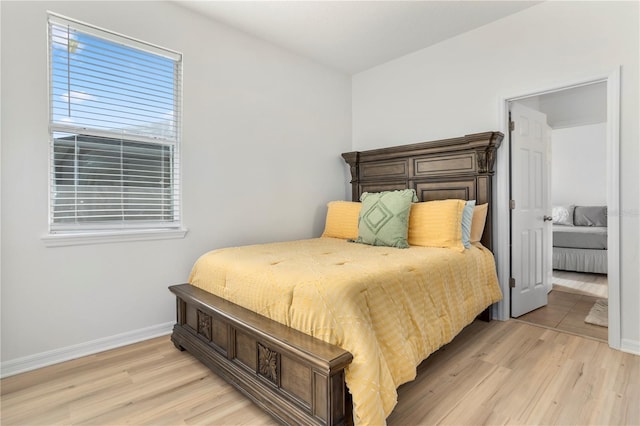 bedroom with light hardwood / wood-style flooring