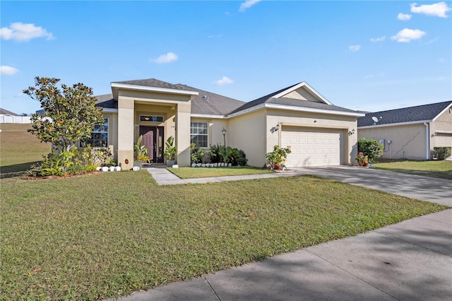 view of front of house featuring a front lawn and a garage