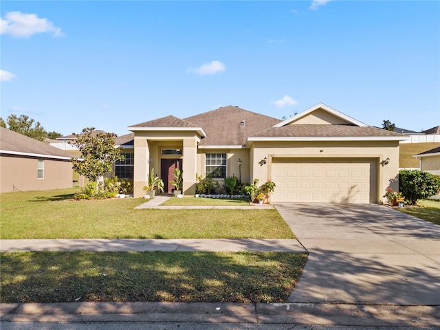 view of front of house featuring a garage and a front lawn