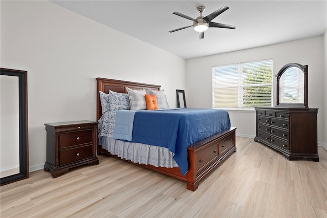 bedroom with ceiling fan and light hardwood / wood-style flooring