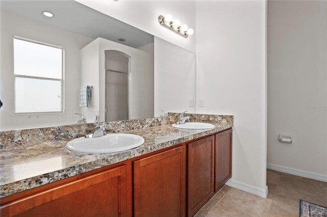 bathroom with tile patterned floors and vanity