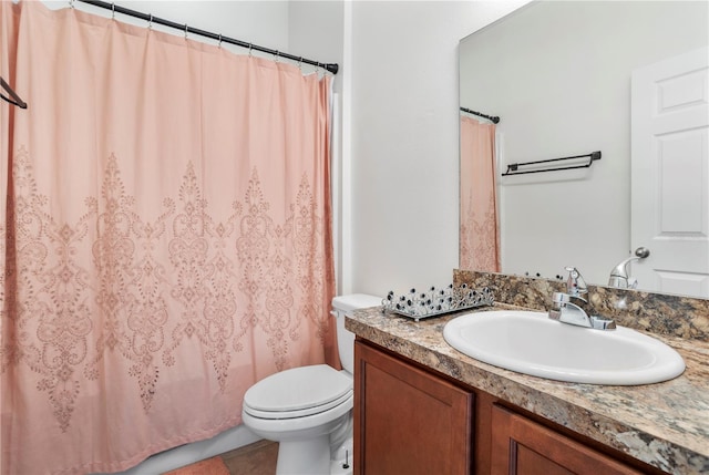 bathroom with tile patterned flooring, vanity, toilet, and a shower with shower curtain