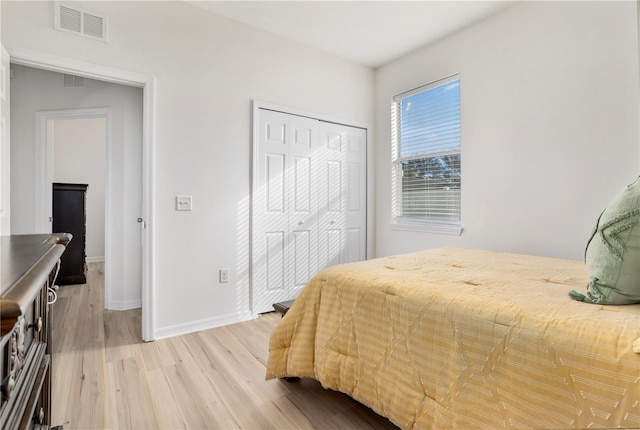 bedroom featuring a closet and hardwood / wood-style flooring