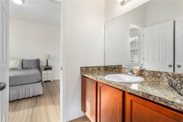 bathroom featuring vanity and hardwood / wood-style flooring