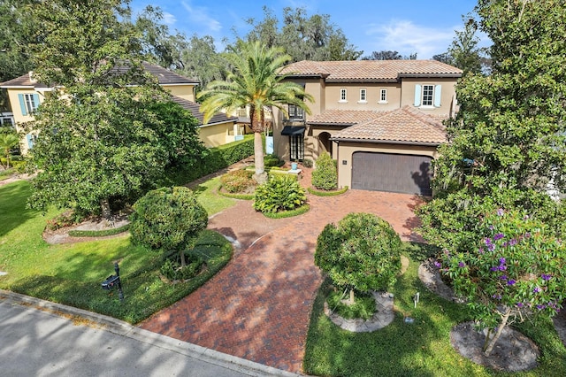 mediterranean / spanish-style house featuring a garage