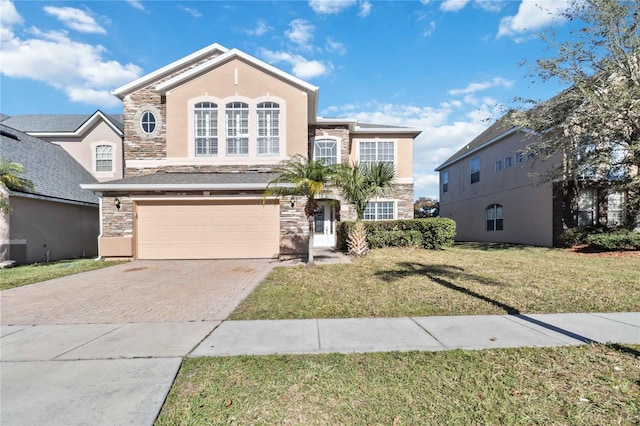 view of front facade featuring a front yard and a garage