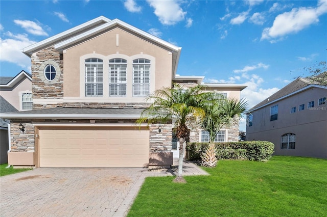 view of front of house featuring a garage and a front yard