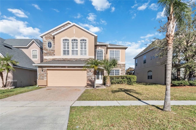 view of front property with a garage and a front lawn