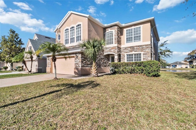 view of front of home featuring a front yard and a garage