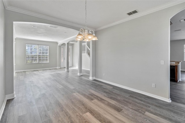 unfurnished dining area with crown molding, hardwood / wood-style floors, and a notable chandelier