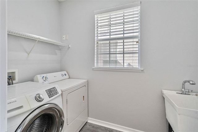 washroom with washing machine and dryer