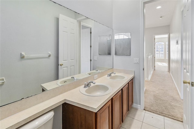 bathroom featuring toilet, vanity, and tile patterned floors