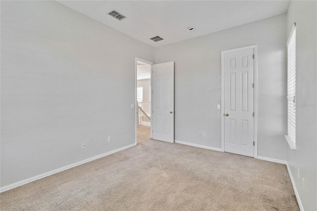 unfurnished bedroom with light carpet