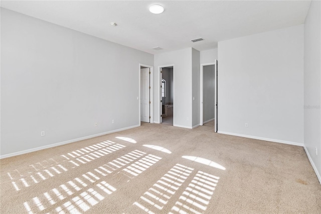 unfurnished bedroom featuring light colored carpet