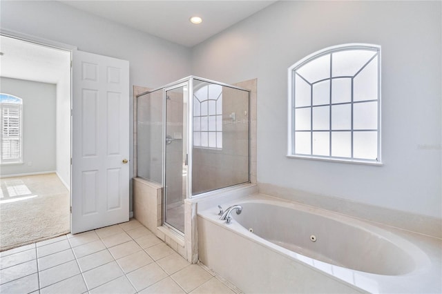 bathroom with tile patterned flooring and separate shower and tub