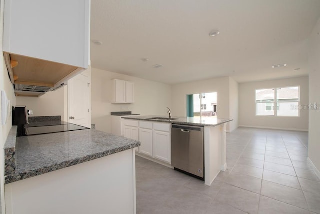 kitchen with stainless steel dishwasher, a sink, light stone countertops, and white cabinets