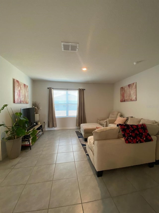 living room with visible vents and light tile patterned flooring