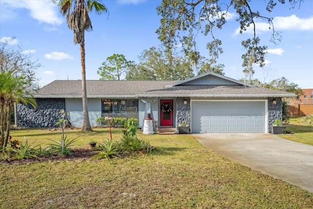 ranch-style home featuring a garage and a front lawn