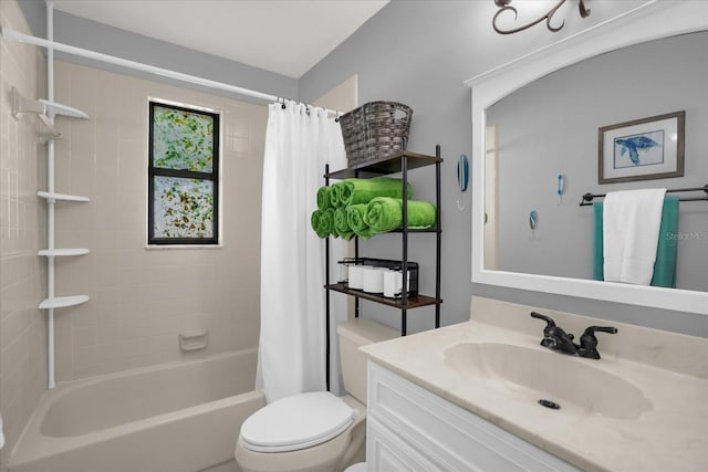 full bathroom featuring shower / tub combo, vanity, and toilet